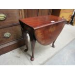 An Edwardian mahogany oval top occasional table,