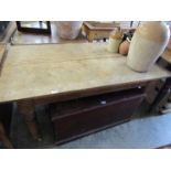 A Victorian pine base table with two plank hardwood top,