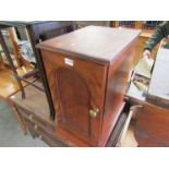 A Victorian stained hardwood single door pot cupboard