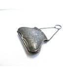 A silver purse with allover floral detail, vacant shield cartouche, Birmingham 1914, 7.