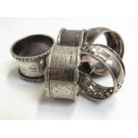 Four silver napkin rings and one unmarked (5) 98g