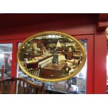 A 19th Century reeded gilt framed oval bevel edged wall hanging mirror (possibly re-gilded) 82cm