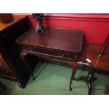 A George III style mahogany silver table with single frieze drawer flanked either ends by brushing