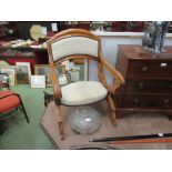 A Victorian walnut open chair with a hinged movement to arm supports,