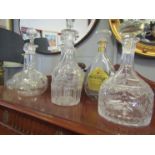 Six various molded glass decanters with stoppers