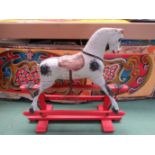 A late 19th/early 20th Century painted wooden rocking horse on trestle rocker, approx.