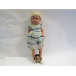 A 1950's composition walking girl doll in blue dress and a small celluloid doll (2)