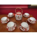 A Chinese tea set comprising teapot a/f, six cups and saucers,