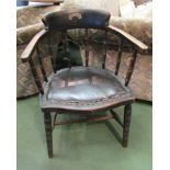 An Edwardian oak and ash captain's desk chair with ring turned decoration,