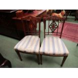 Two similar "Edwards & Roberts" Sheraton style Edwardian chairs with inlaid decoration,