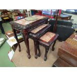 A nest of three Oriental style graduating occasional tables with variegated marble inset tops