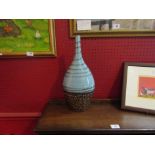 A turquoise and bronzed effect vase,