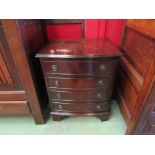 A Georgian style mahogany bow fronted chest of small proportions,