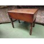 A circa 1880 mahogany commode with ceramic liner on turned legs,