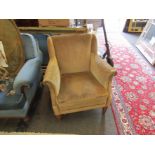 A 1940's pale green upholstered armchair