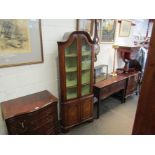 A walnut glazed corner cupboard