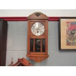 A 1930's German drop-dial wall clock with a pair of oak mirrored wall sconces (3)