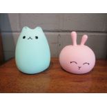 Two animal illuminated night or mood lights as a cat and a rabbit