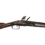 An 18th Century and later flintlock carbine, the lock plate engraved with swirled design,