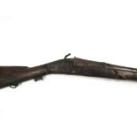 A 19th Century matchlock musket, various repairs, the stock stamped 17. 104.5cm total length.