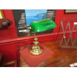 A brass banker's lamp, brass with green glass shade,