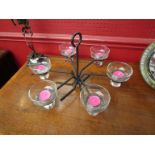 A wrought metal night light six branch table centrepiece
