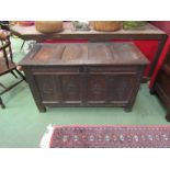 A 17th Century oak panelled coffer with lozenge front,