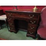 A mahogany kneehole desk circa 1740/80, eight drawers and recessed door, oak lined drawers,