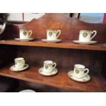 A set of six Royal Doulton small coffee cups and saucers,