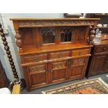 An Old Charm oak court cupboard, three drawer over three cupboard door base,