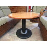 A modern circular occasional table on metal base,