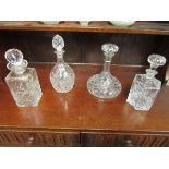 An Edinburgh crystal whisky decanter with three other examples