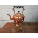An Art Nouveau copper kettle on stand