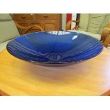 A deep cobalt blue glass bowl, with outer impressed concentric rings,