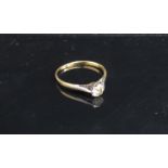 A gold diamond solitaire ring, marks rubbed. Size M/N, 1.