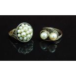 Two pearl set rings, one stamped 18ct/9ct. Size Q, the other unmarked. Size R, 14.