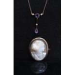 An amethyst coloured stone and pearl drop pendant necklace,