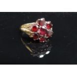 A 9ct gold garnet cluster ring. Size M, 3.