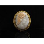 A large carved shell cameo brooch in pinch beck mount, 6cm x 5.