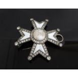 A Maltese Cross brooch/pendant set with semi-precious clear stones