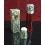 A silver topped ruby glass scent bottle,