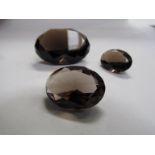 Three loose quartz stones,