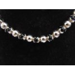 A Premavera silver and onyx necklace, 39cm long,