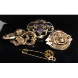 Three Victorian brooches in gilt coloured metal, one with ametyst stone,