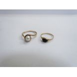 A 9ct gold ring with single pearl in crossover setting. Size T, 2.9g and a 9ct gold ring, worn.