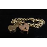 A 9ct gold bracelet with two 9ct gold padlock clasps, 15.