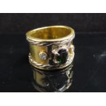 A gold band with a white gold rope trim,