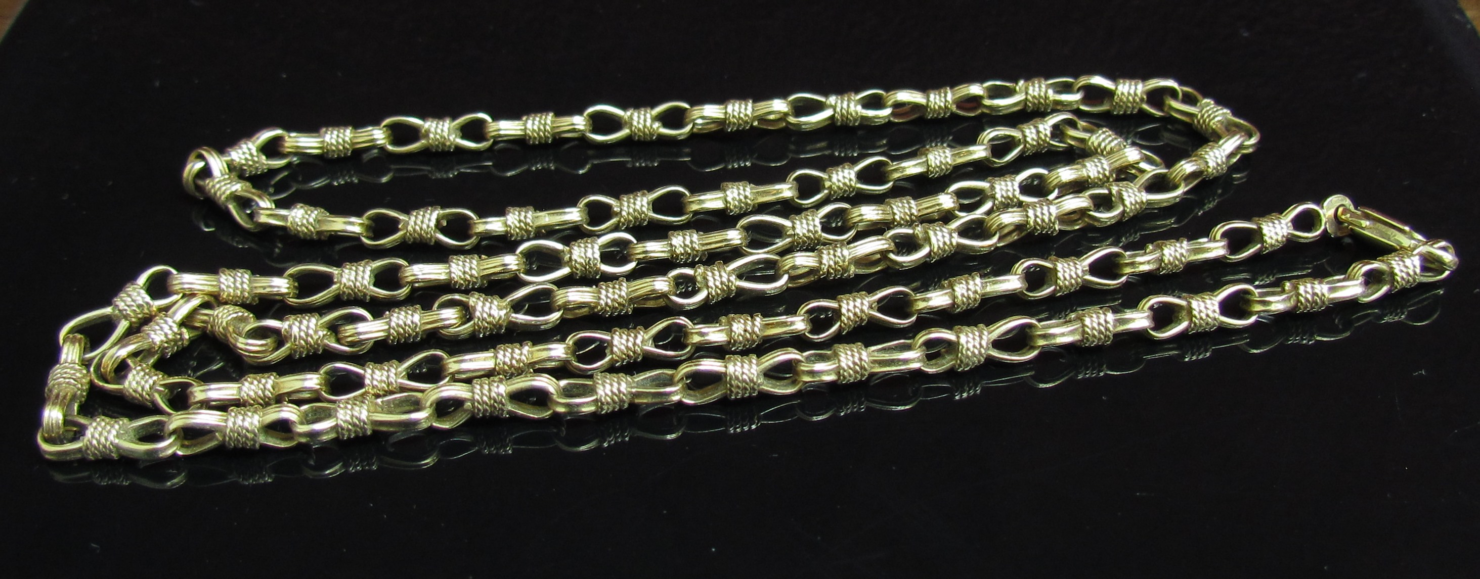 A 9ct gold fancy link necklace, 62cm long,