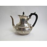 A Mappin & Webb silver coffee pot with fluted detail, ebony knop and handle, Sheffield 1915,