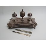 A silver plate desk stand with central globe container,